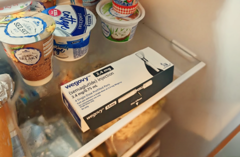 Wegovy (semaglutide) weight-loss injection box stored in a refrigerator obtained through a telehealth provider like QuickMD.