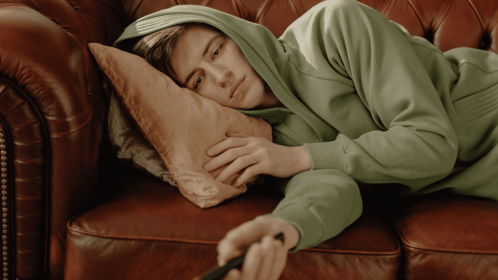 Man on couch experiencing opioid cravings