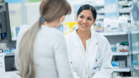 Pharmacist explaining Suboxone vs methadone vs naltrexone to a customer