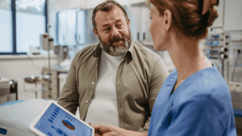 Man with obesity discussing weight-related breathing problems and GLP-1 treatment options with a healthcare provider in a clinic