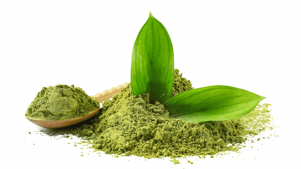 Kratom powder and green leaves on a white background, representing of 7-OH