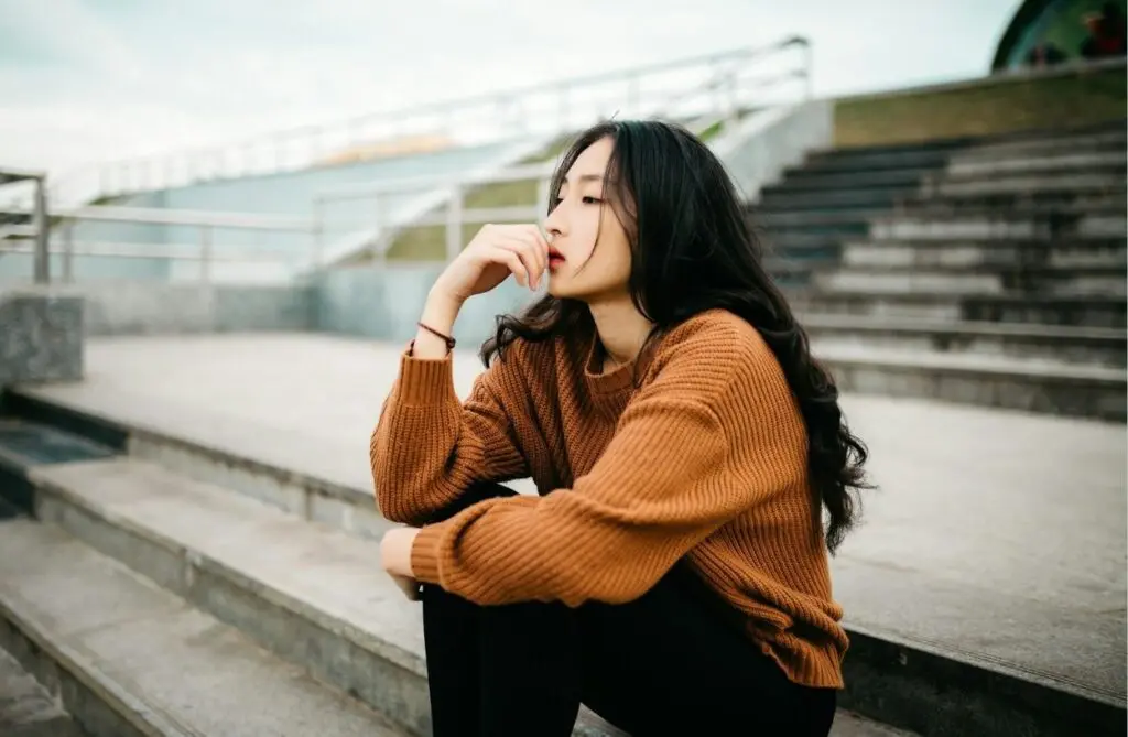 woman sitting thinking dealing with cravings while on suboxone