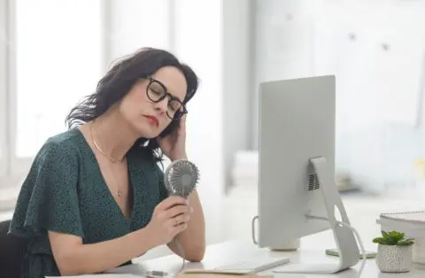 woman experiencing a hot flash