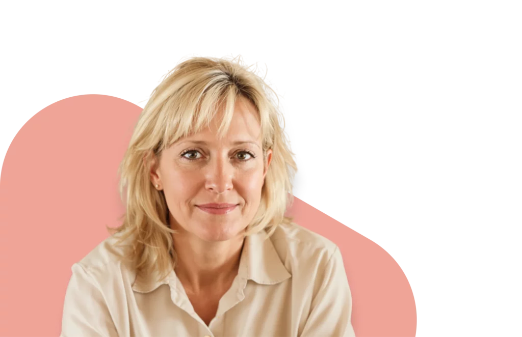 Middle-aged blonde woman smiling confidently, representing menopausal hormone therapy (MHT) treatment options