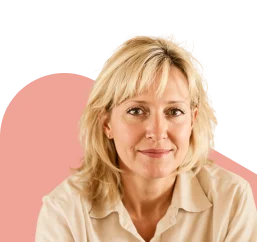 Middle-aged blonde woman smiling confidently, representing menopausal hormone therapy (MHT) treatment