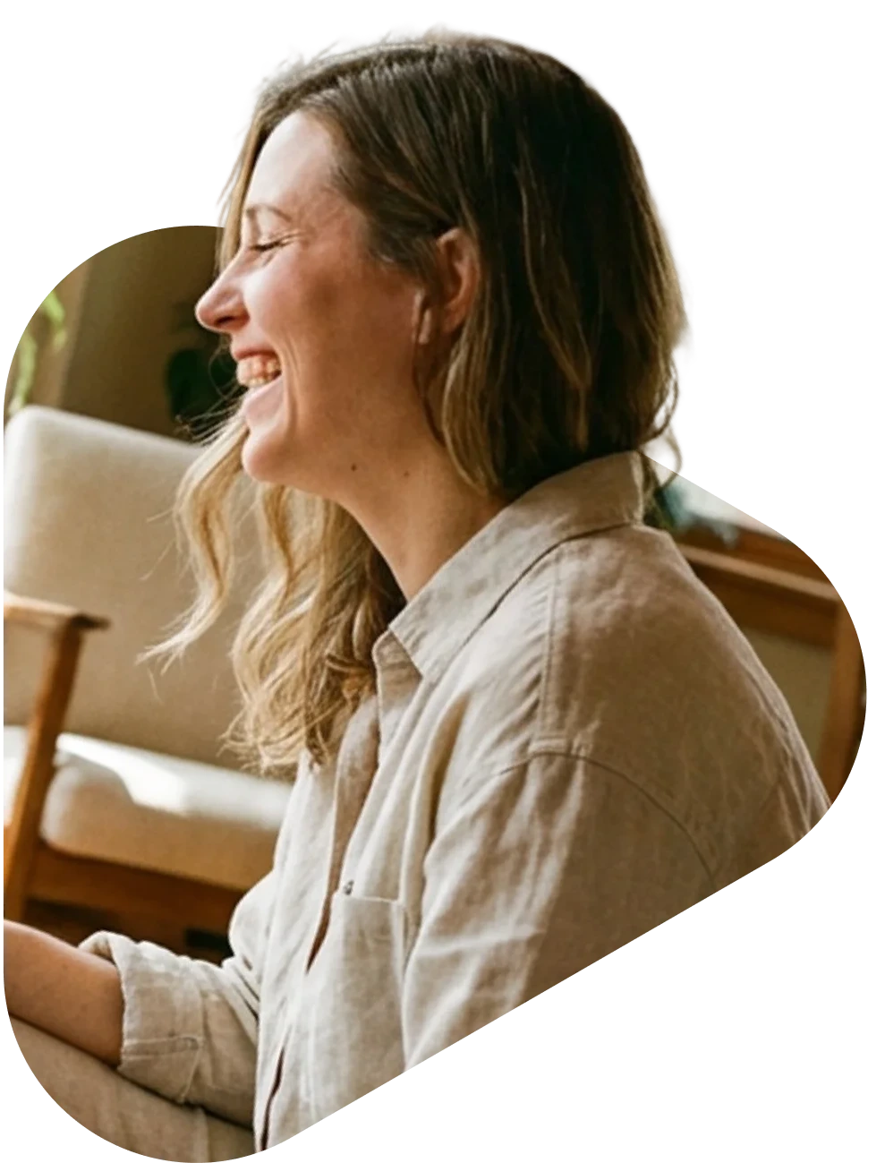 Woman smiling and feeling hopeful during an online peer support group for addiction recovery