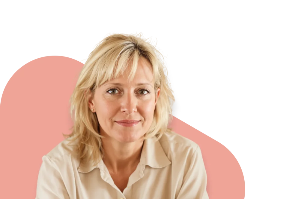 Smiling woman managing menopause symptoms with hormone therapy from QuickMD