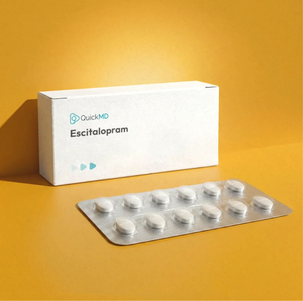 QuickMD Escitalopram medication box with blister pack of white oval tablets on yellow background