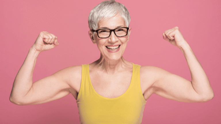 Older woman flexing and preventing muscle loss on GLP-1 weight loss medications