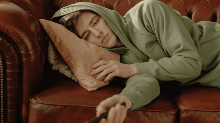 Man on couch experiencing opioid cravings