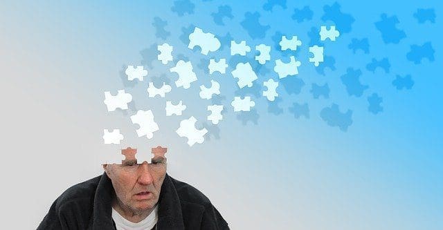 Man with dementia and puzzle pieces leaving his mind