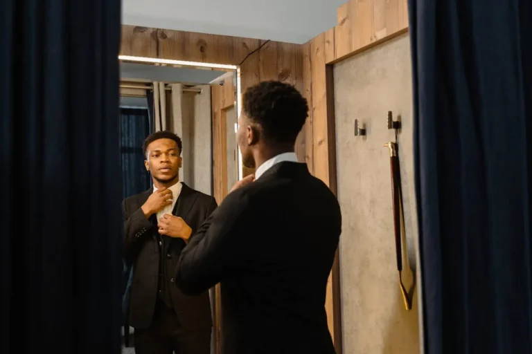 guy looking in the mirror reflecting on himself