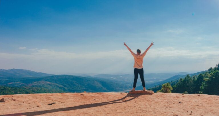 Person celebrating outside after mental health advice with counseling services online