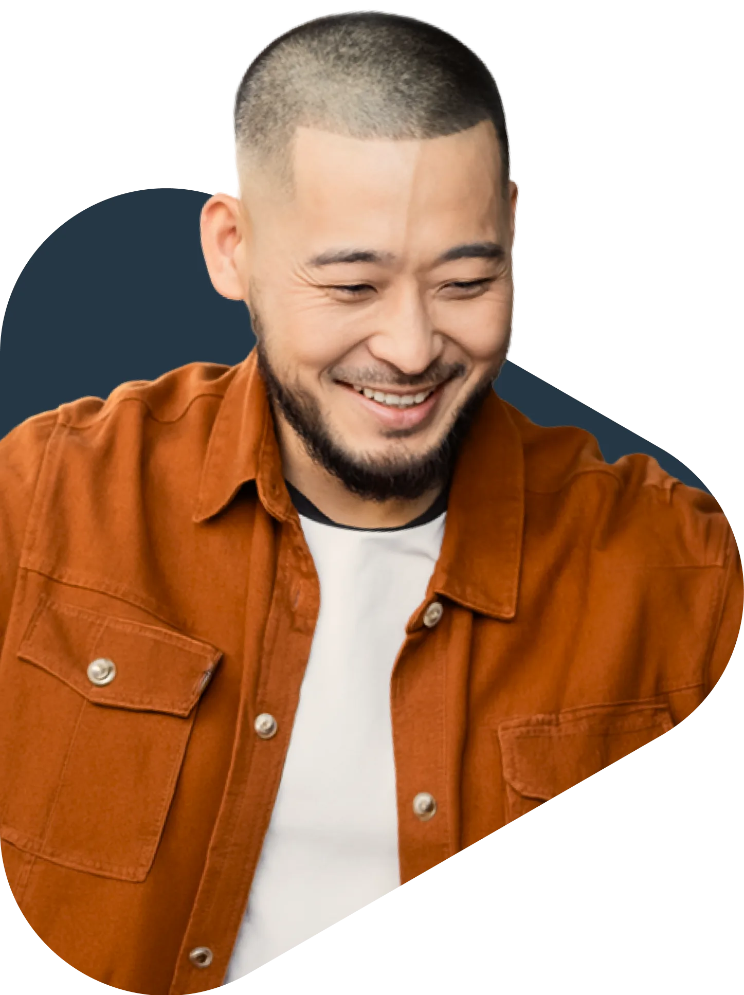 Smiling young Asian man with short hair and beard wearing an orange jacket over a white t-shirt
