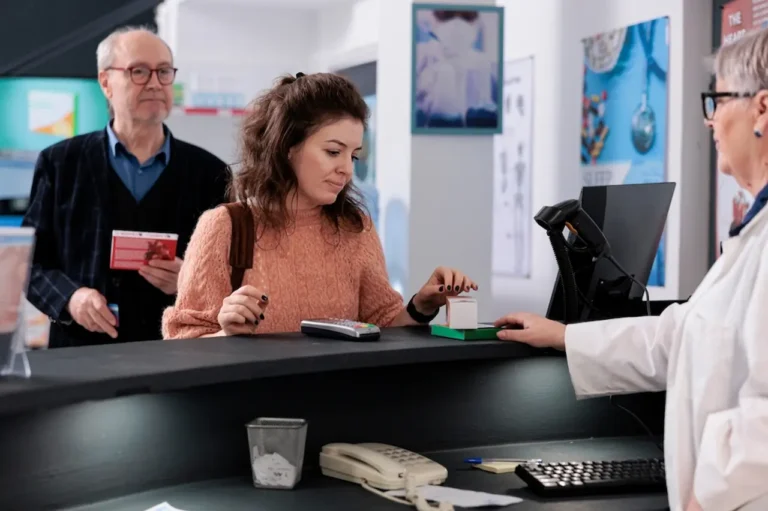 woman-buying-mht-medication-at-pharmacy-counter