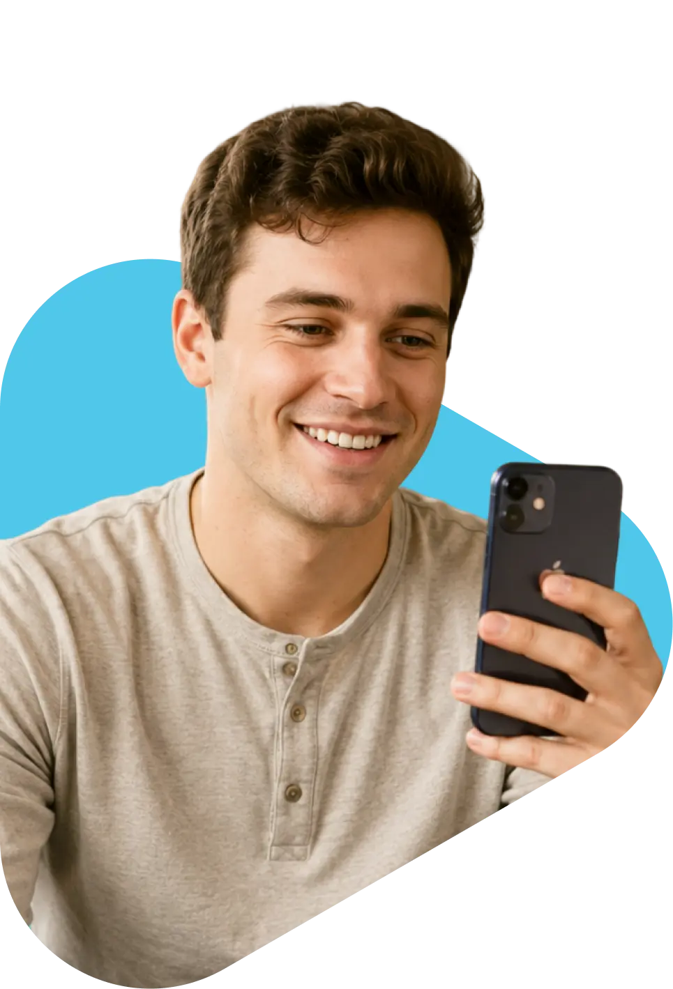 Smiling young man holding a smartphone, consulting with QuickMD online for 7-OH kratom treatment via telehealth