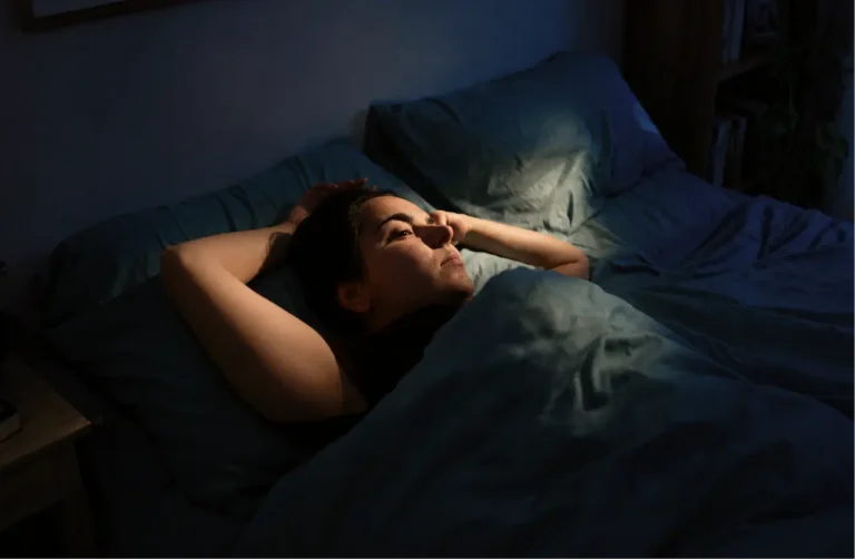 woman-lying-awake-in-bed-illustrating-symptoms-of-depression-such-as-low-mood-and-fatigue