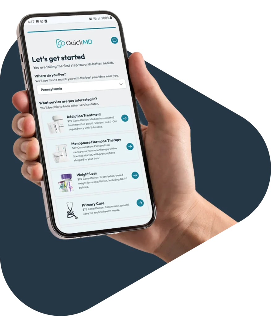 Hand holding a smartphone displaying the QuickMD app's "Let's get started" onboarding screen with telehealth service options