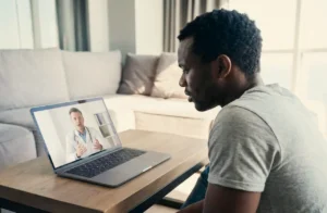 man meeting with a doctor online