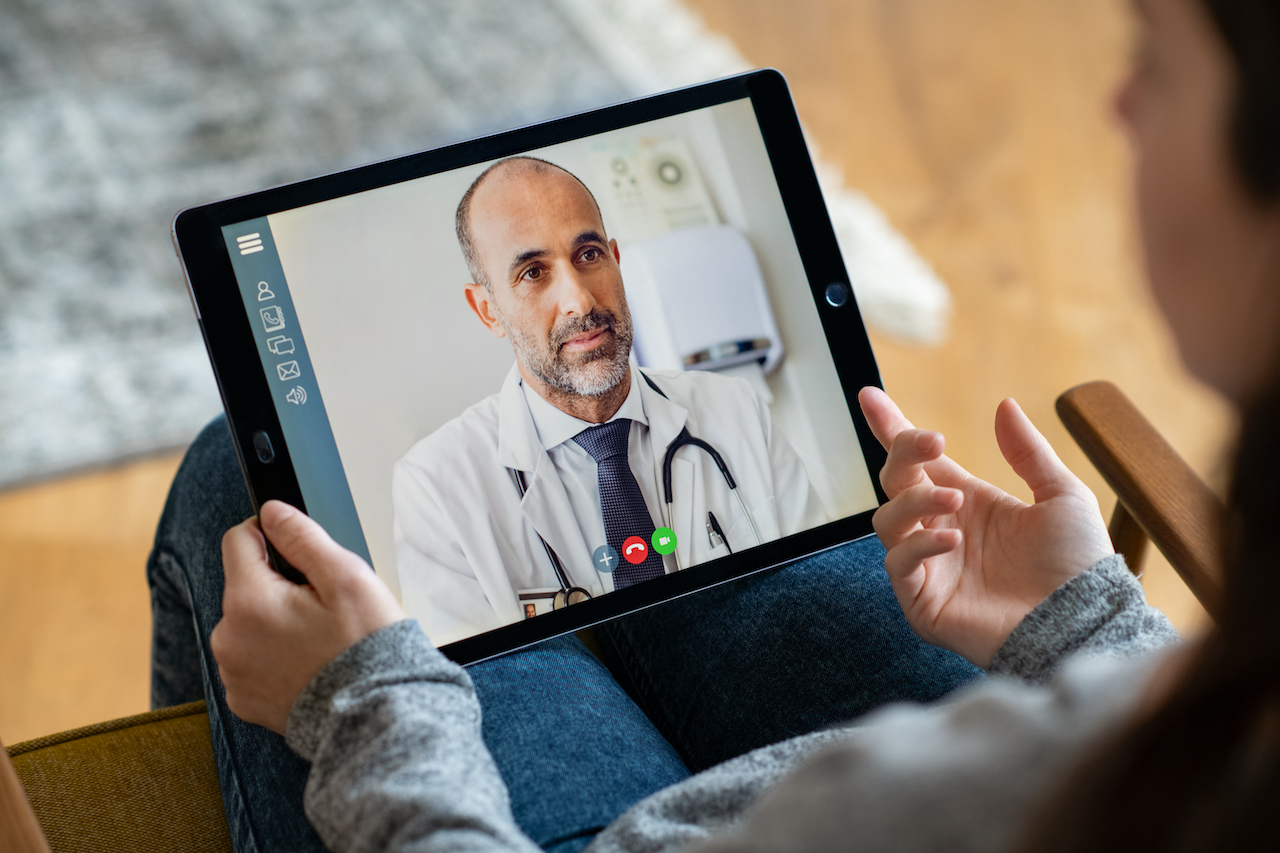 Doctor conducting telehealth appointment for addiction and weight loss treatment