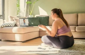 woman-in-workout-clothe-speaking-to-doctor-online