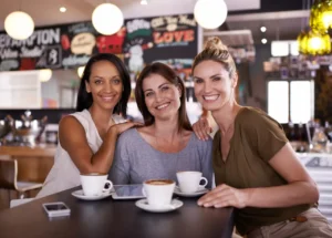 women-looking-relieved-in-coffee-shop