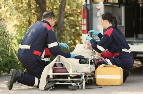 person-getting-help-from-emergency-responders